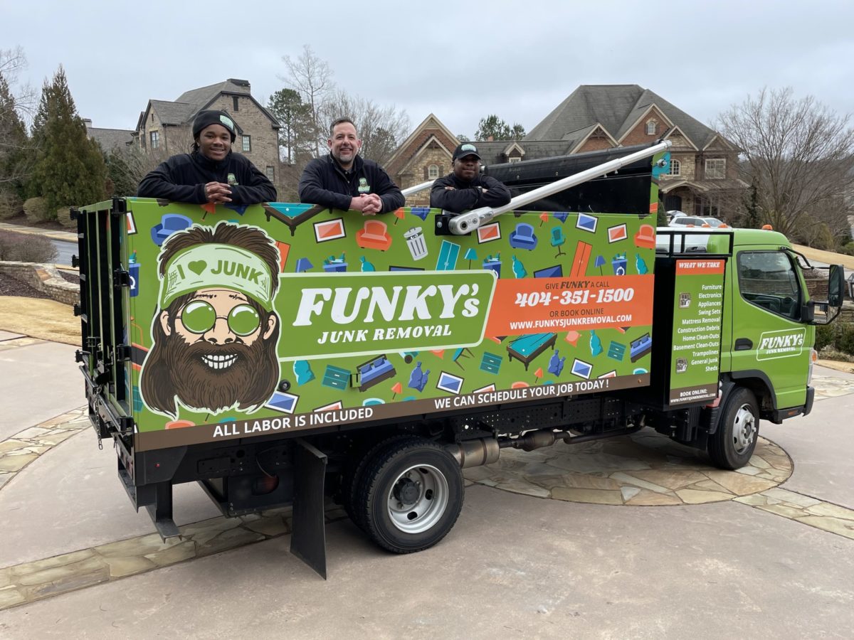 funkys junk removal crew standing in junk removal truck before starting junk removal services
